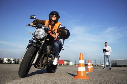 A person taking the Motorcycle Skills Test