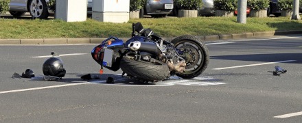 Motocycle knocked down in intersection