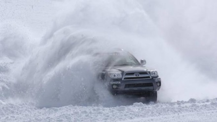 Truck Sliding in Snow with a cloud of powder behind it