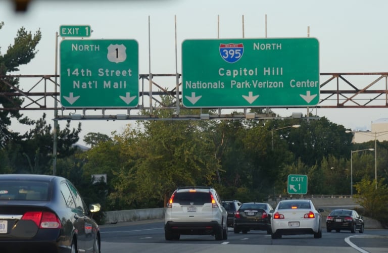 Interstate 395 with directional signs to the Capitol Hill and National Mall in Washington, District of Columbia.