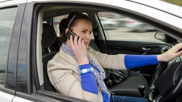 a man talking on the phone while driving