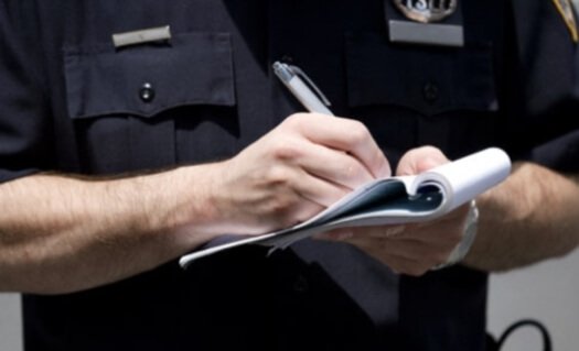 Police officer writing a ticket.
