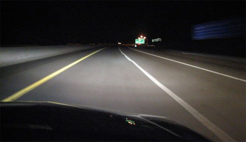 driving at night with the headlights on.